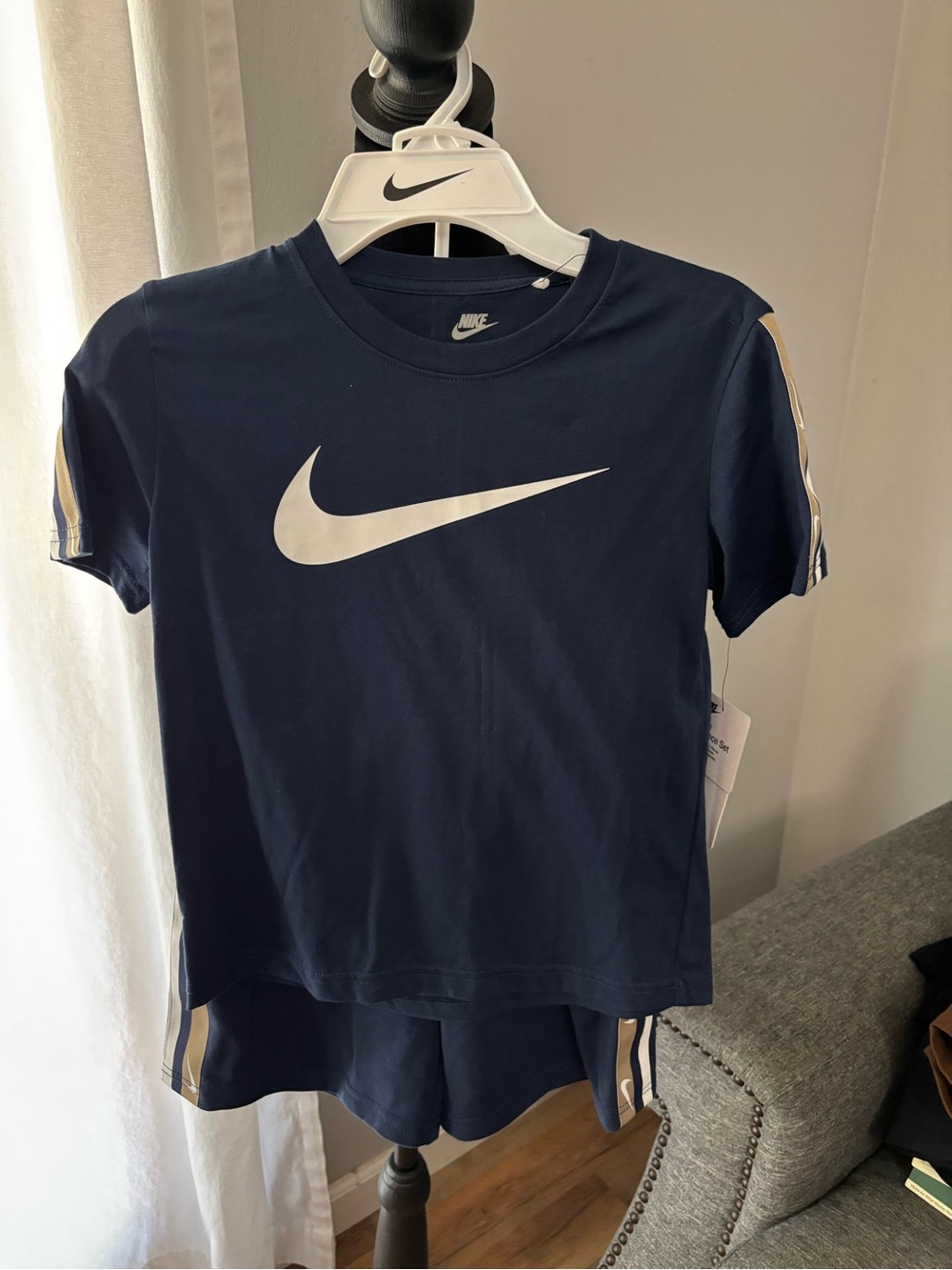 Nike Boys Navy Short Sleeve Tee with White Swoosh and Cream Stripe Accents